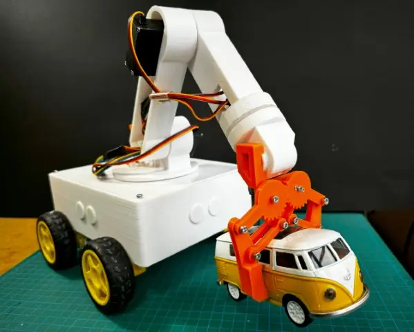 Mobile robot arm OmObiArm showcasing its gripping mechanism, holding a toy car, designed with Arduino and 3D-printed components.