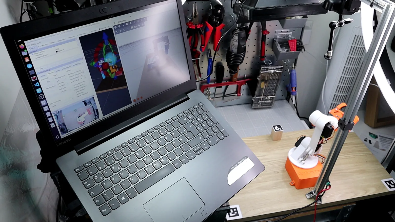 Full workspace overview with camera, markers, and robot arm
