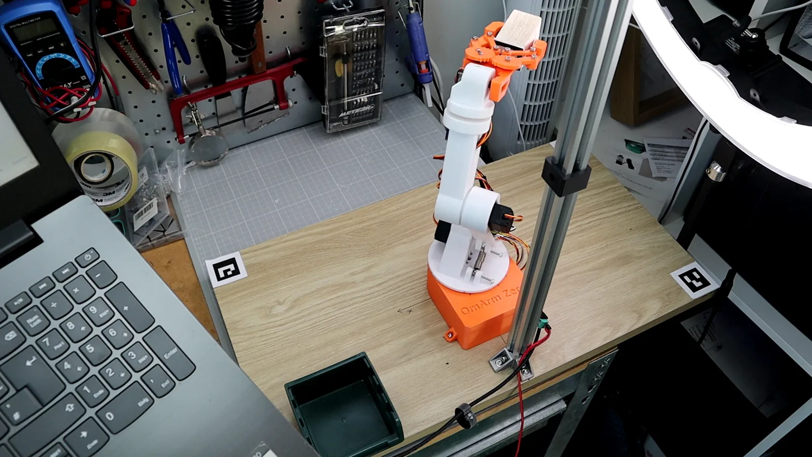 Real robot with cube placed, task complete