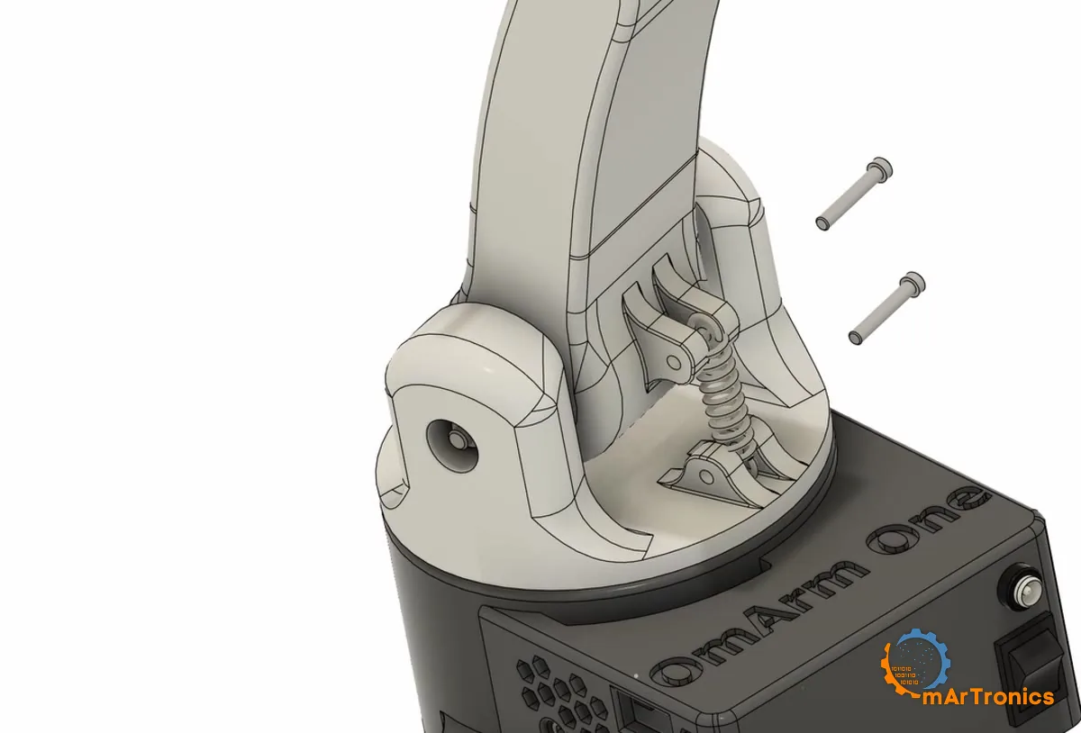 The shoulder spring hooked between its two printed lugs